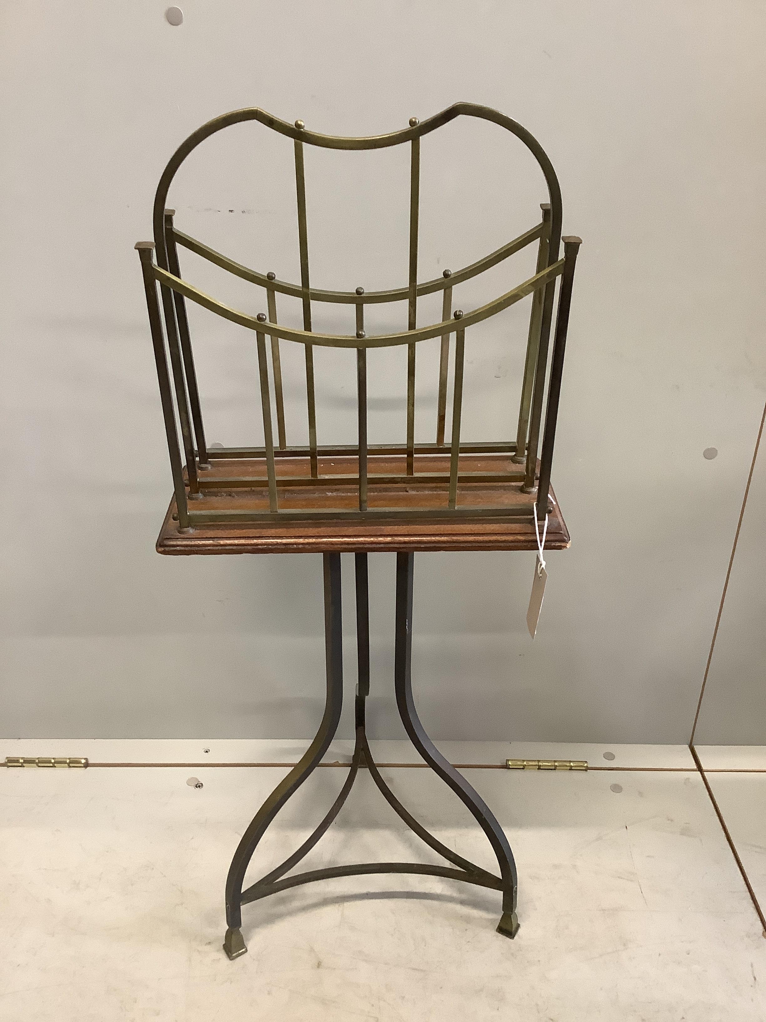 An early 20th century oak and brass two division revolving newspaper stand, width 36cm, depth 16cm, height 85cm